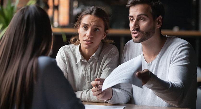 Angry couple arguing with bank manager complain on bad contract