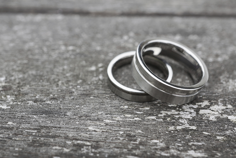 Wedding rings on old wood