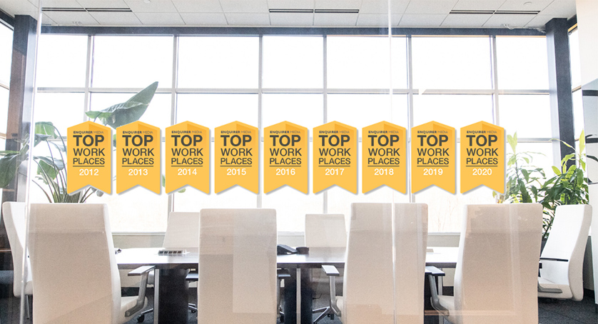 Top Workplaces logos hung in the LCS headquarters