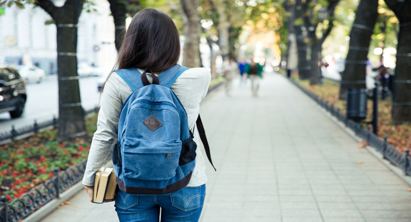 girl with backpack going back to school