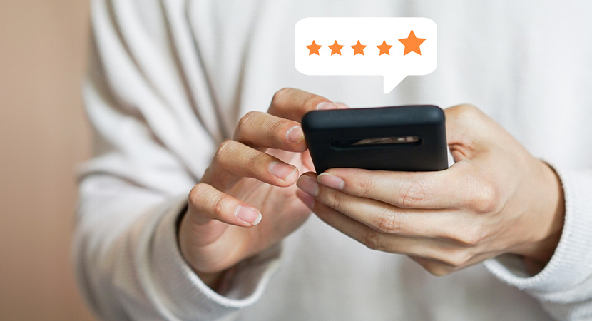 Person using their smart phone is administering a 5 star rating, 5 gold stars appear.