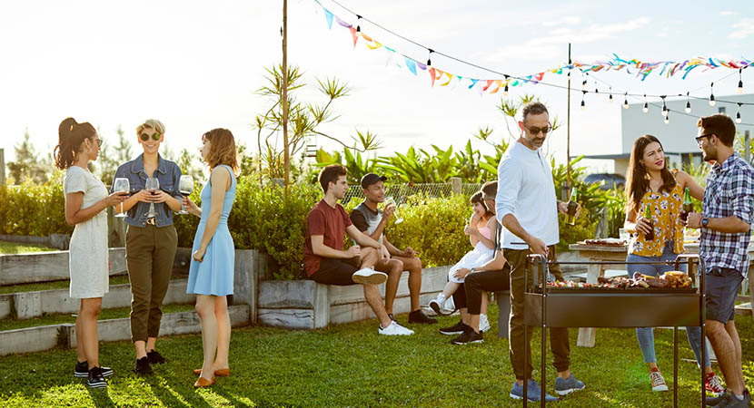 Young adults enjoying a BBQ outside