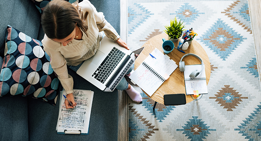 Young businesswoman at home having video call and telecommuting