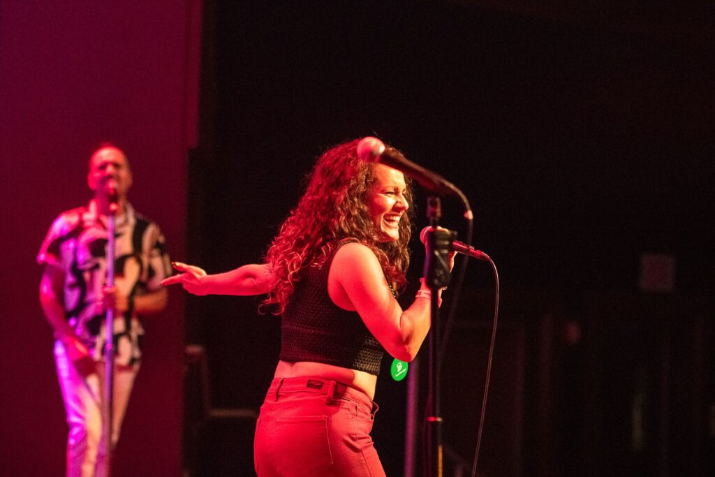 Attendees singing karaoke at the Universal CityWalk social event