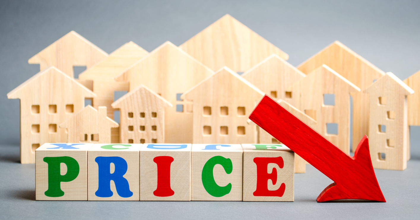 wooden blocks spelling "price" with downward arrow